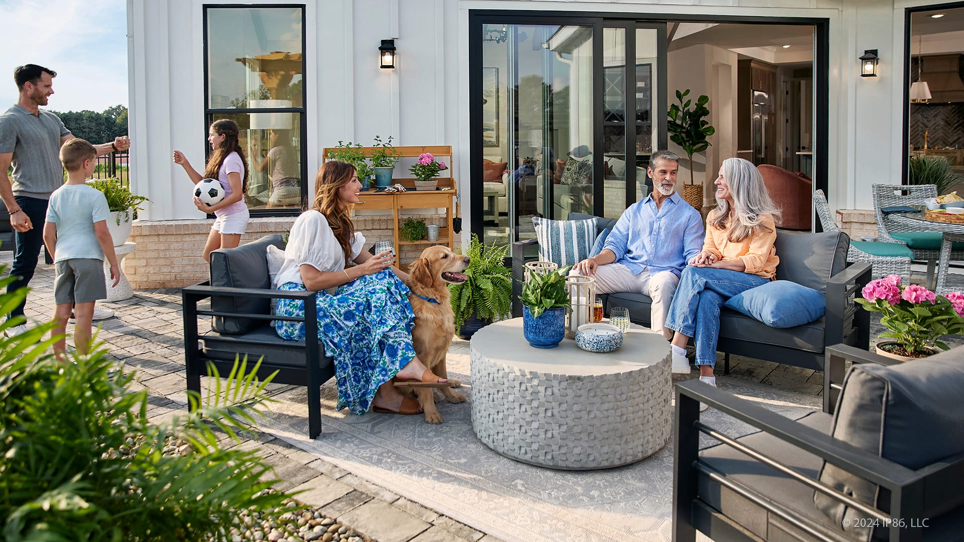 multi-generational family enjoying time together on patio
