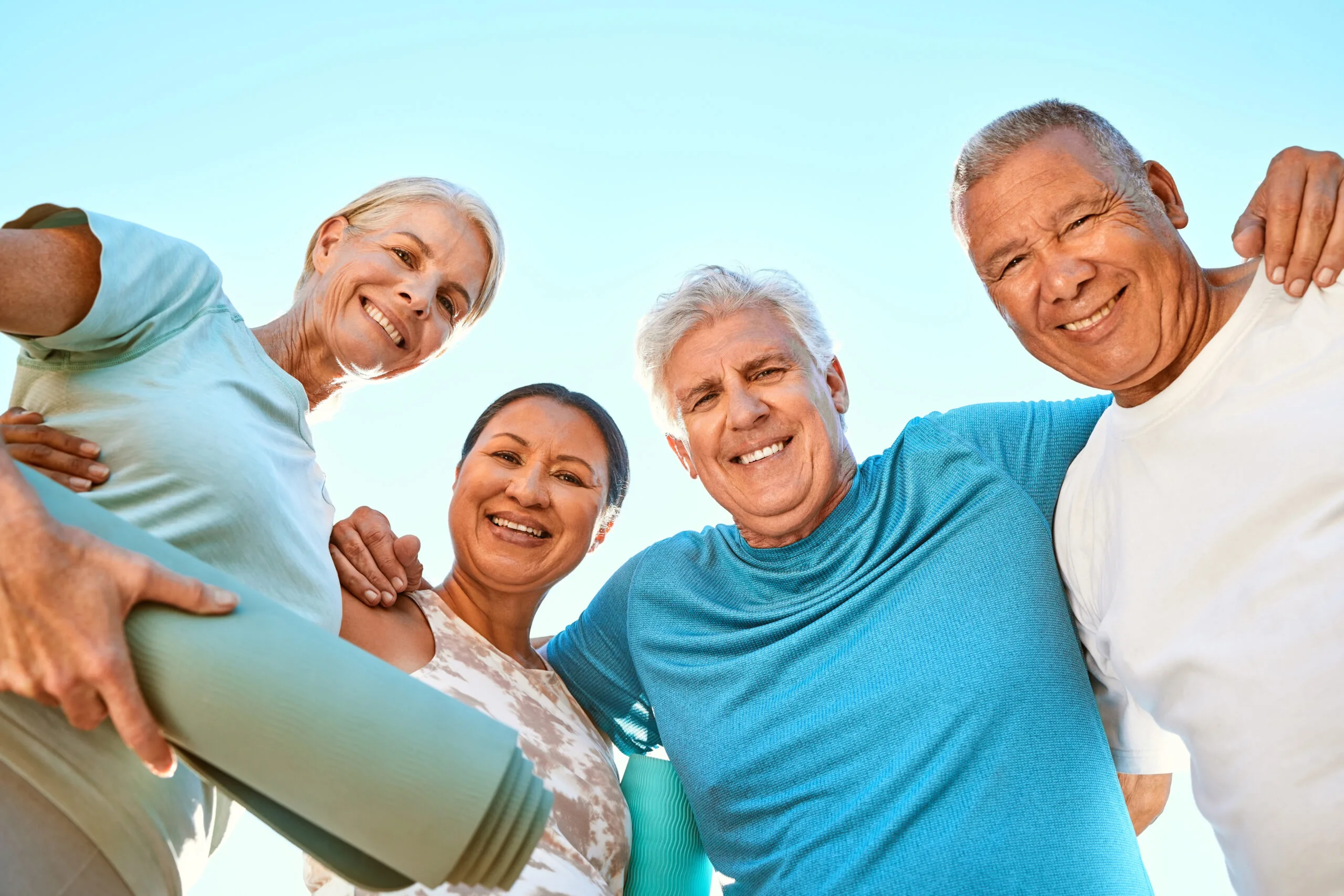 two multi-ethnic couples enjoying an active lifestyle in community