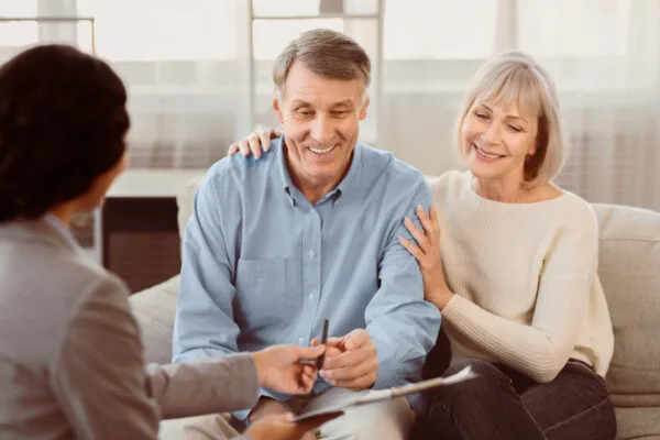 Senior couple visiting financial advisor at office
